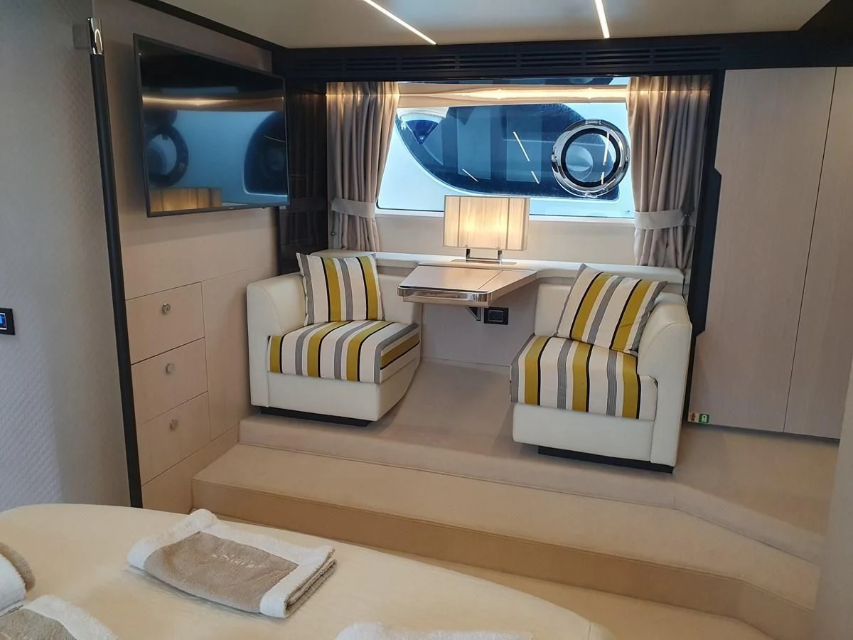a room with a bed and a desk aboard PAVIMAR II Yacht for Sale