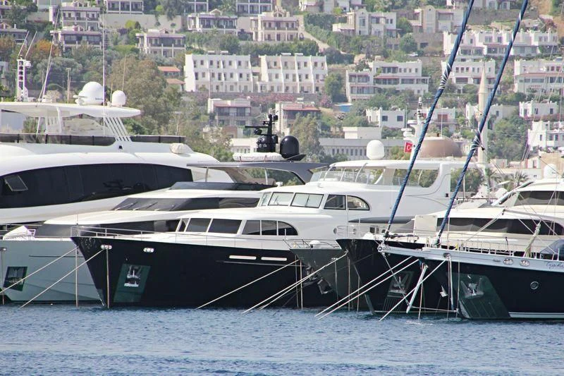 a group of boats are parked in a harbor aboard MAISHA Yacht for Sale