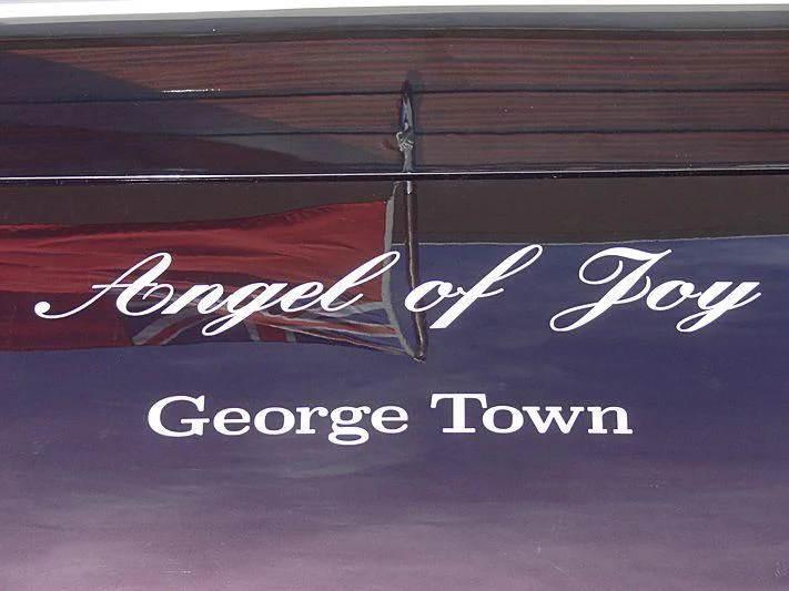 a sign on a wood surface aboard MAISHA Yacht for Sale