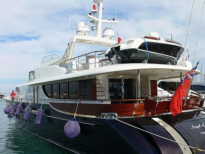 a boat with a red and white stripe on the front aboard MAISHA Yacht for Sale