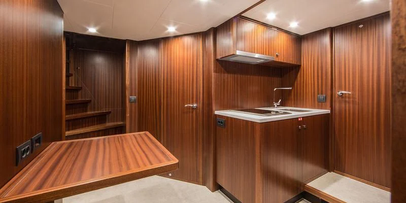 a kitchen with wooden cabinets aboard SEAWOLF Yacht for Sale
