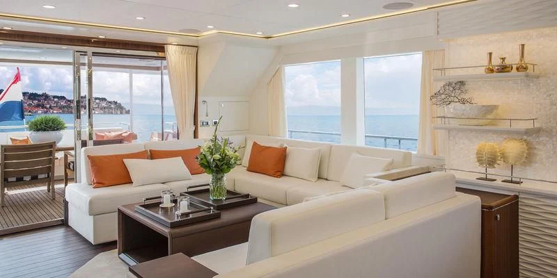 a living room with a large window aboard SEAWOLF Yacht for Sale