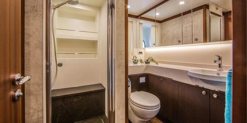 a bathroom with a toilet and a sink aboard SEAWOLF Yacht for Sale