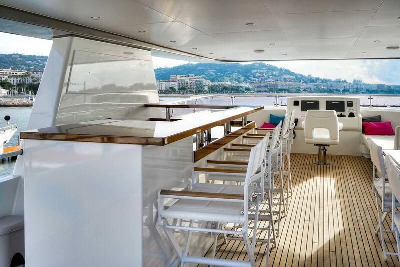 a deck with a view of a city and water aboard SEAWOLF Yacht for Sale