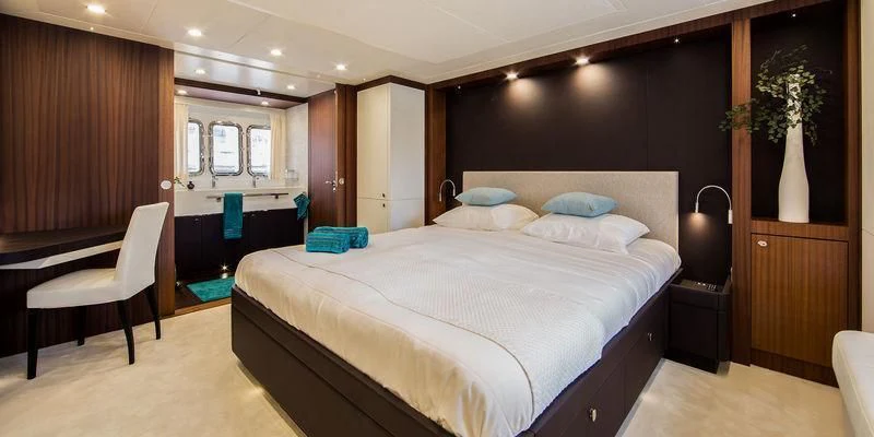 a large bed in a hotel room aboard SEAWOLF Yacht for Sale