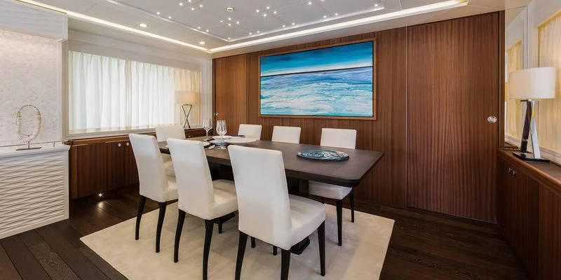 a room with a table and chairs aboard SEAWOLF Yacht for Sale