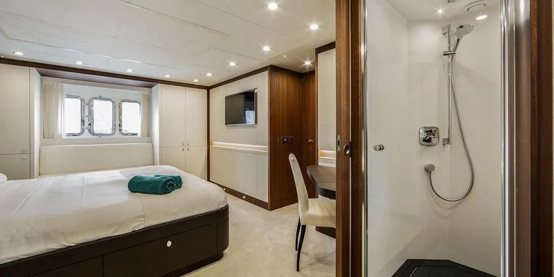 a room with a bed and a desk aboard SEAWOLF Yacht for Sale