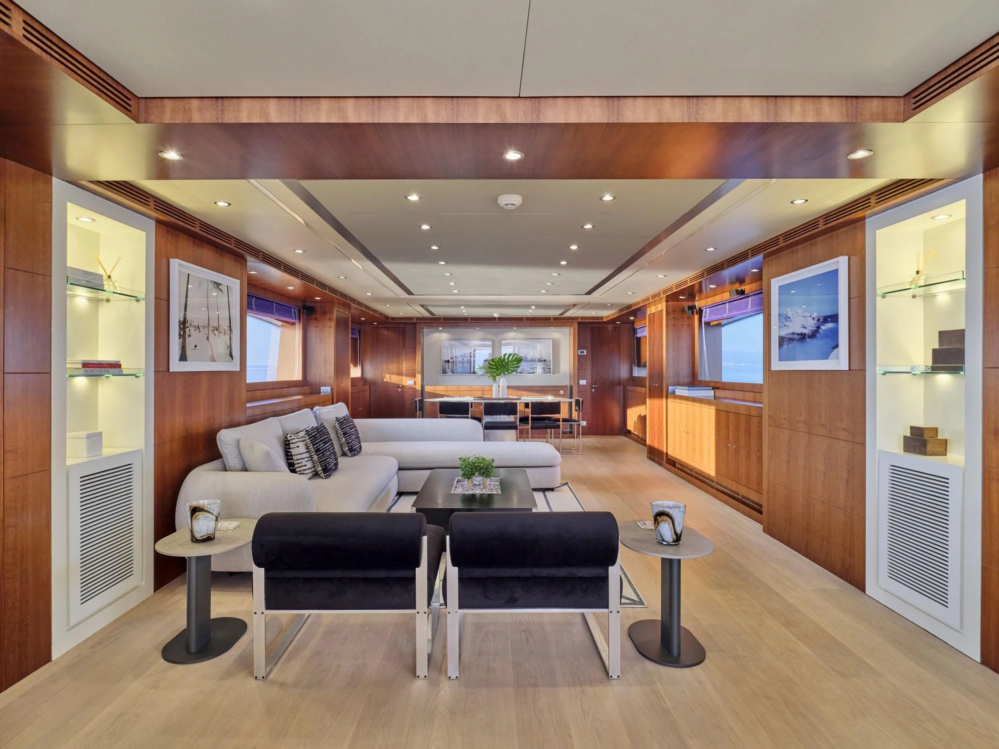 a living room with a couch and a table aboard BEYOND Yacht for Charter