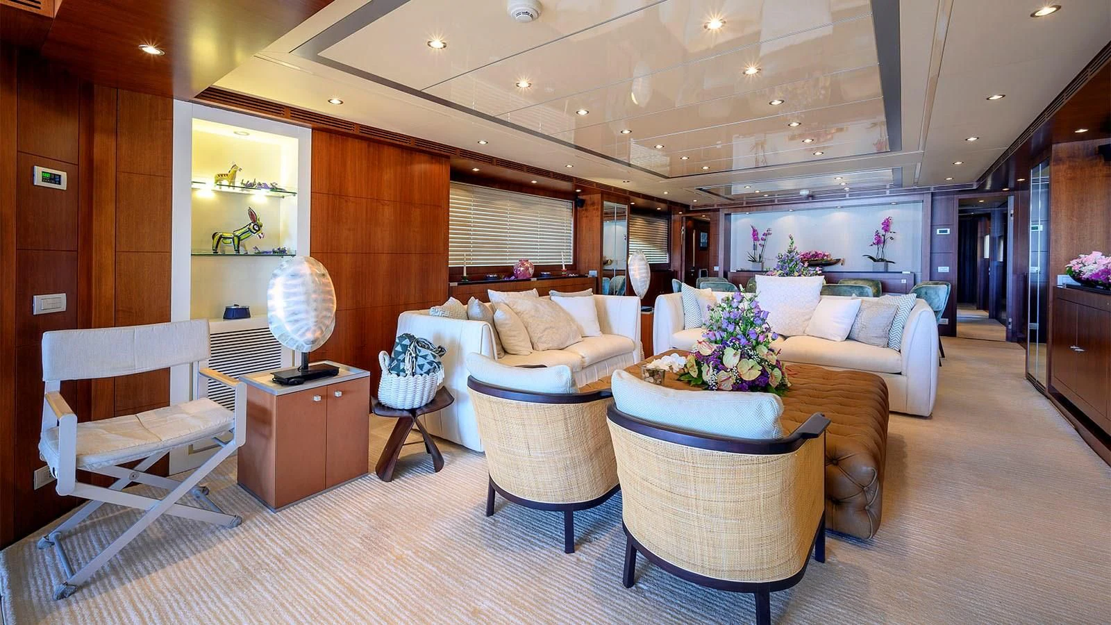a living room with a couch and a table aboard BEYOND Yacht for Charter