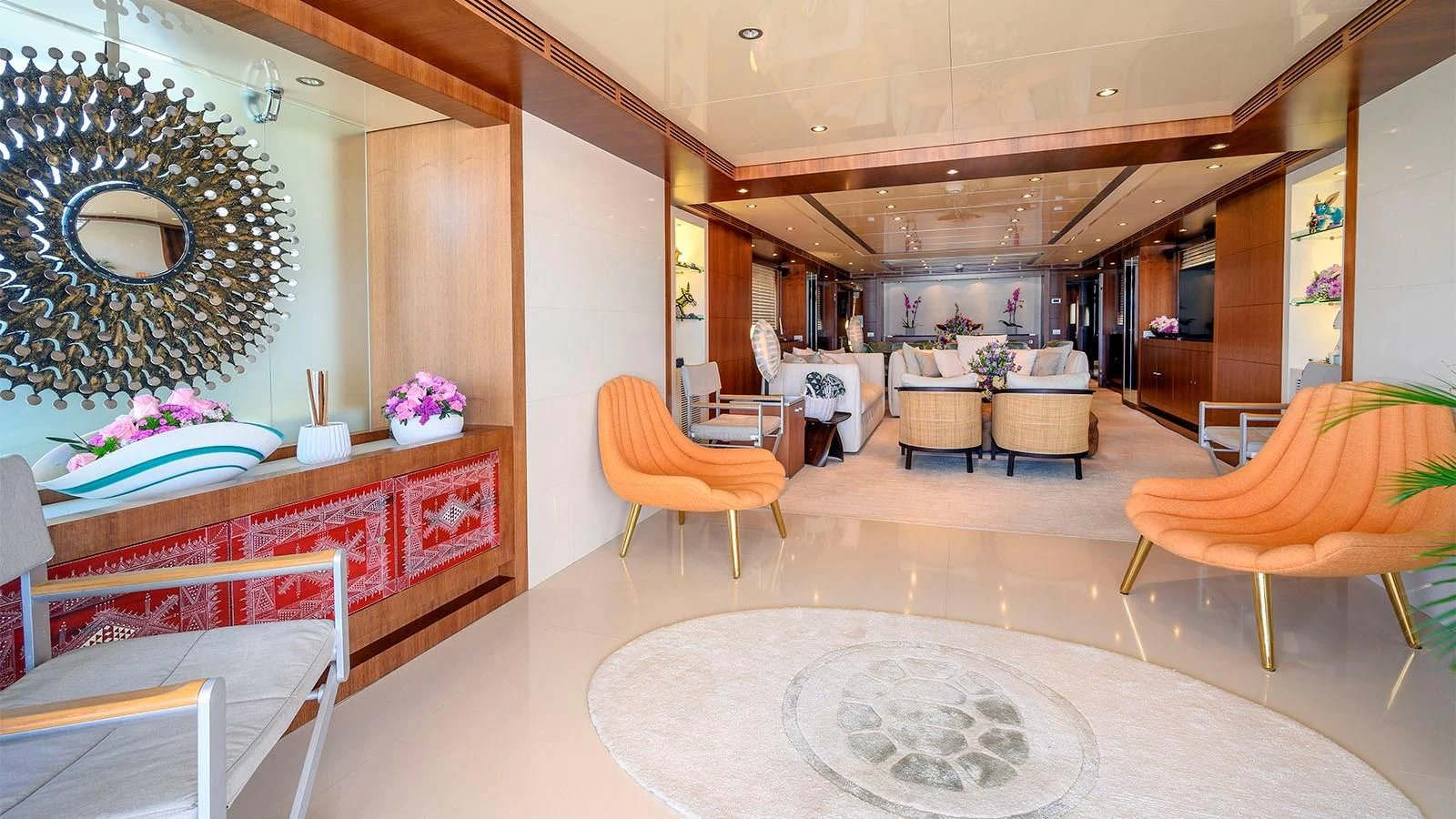 a large room with tables and chairs aboard BEYOND Yacht for Charter