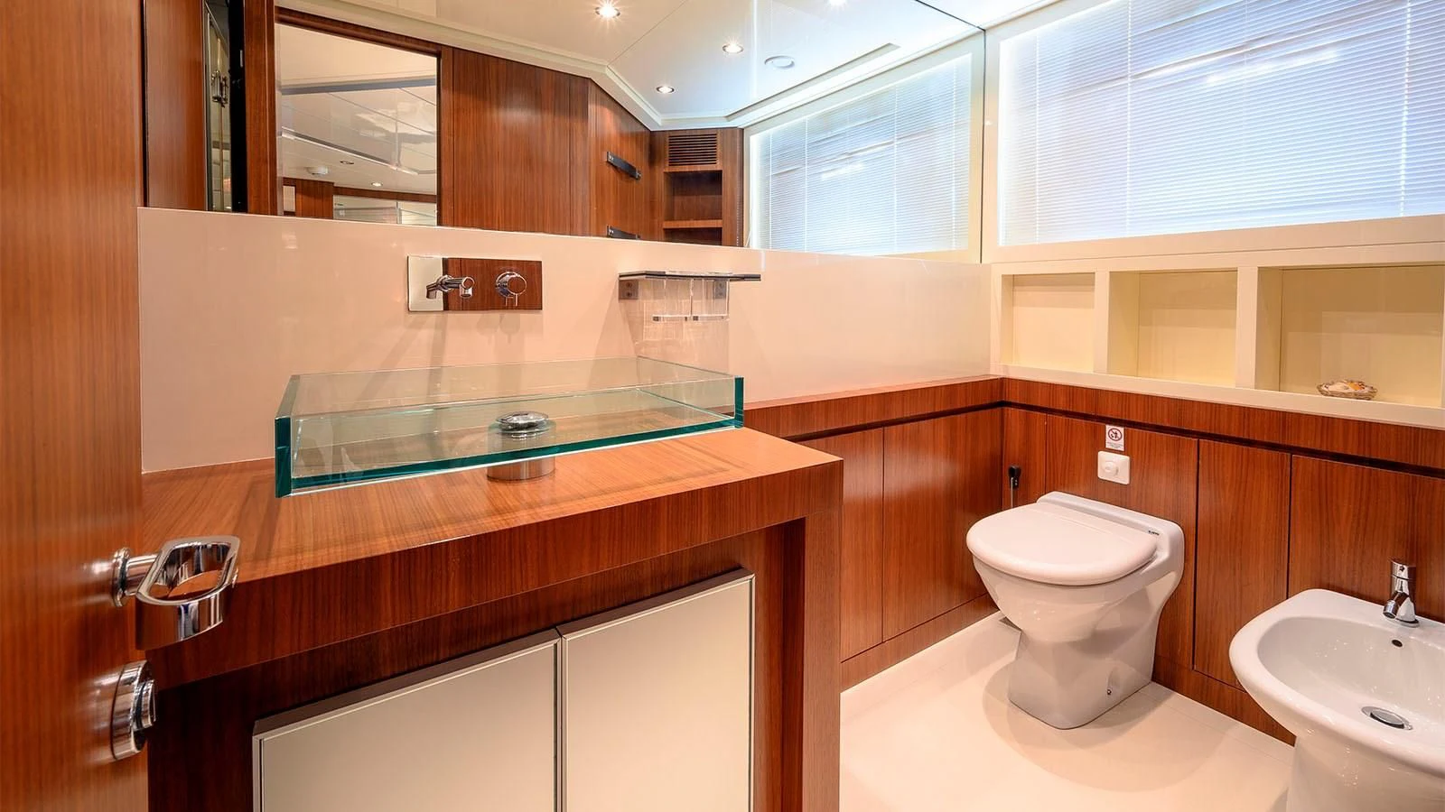 a bathroom with a toilet and sink aboard BEYOND Yacht for Charter