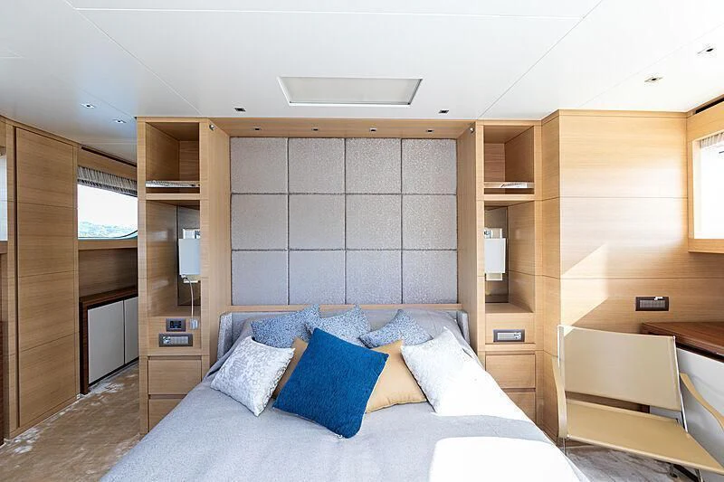 a bed in a room aboard THE UNIFIER KING ABDULAZIZ THE FIRST Yacht for Sale