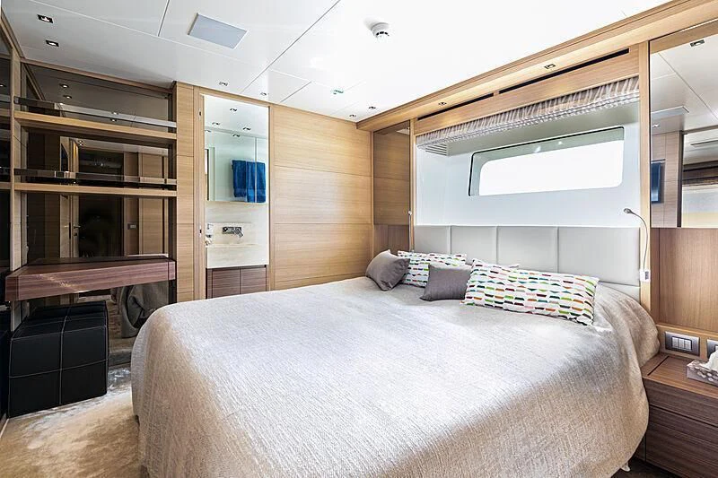 a bed in a room aboard THE UNIFIER KING ABDULAZIZ THE FIRST Yacht for Sale