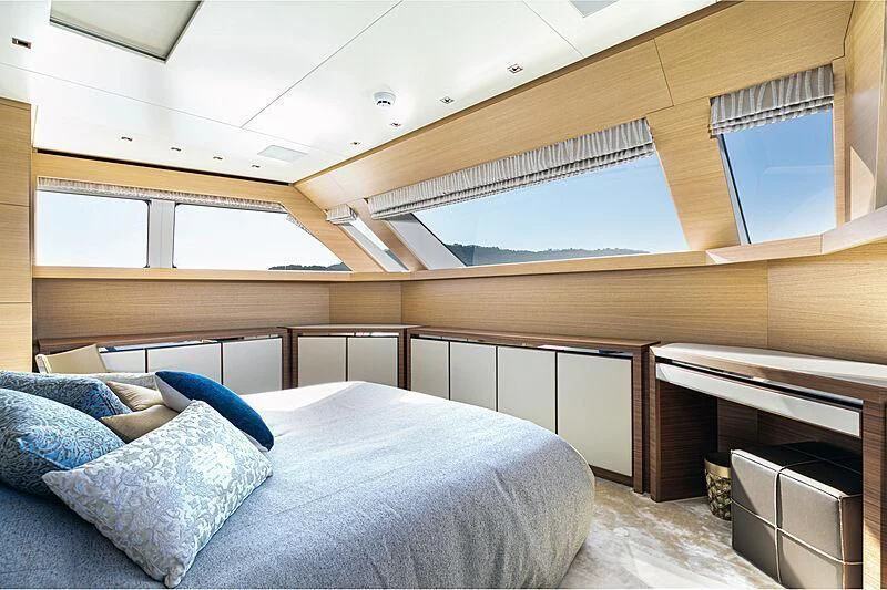 a room with a bed and a window aboard THE UNIFIER KING ABDULAZIZ THE FIRST Yacht for Sale