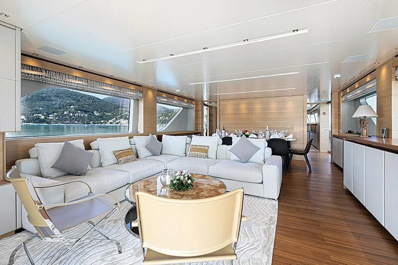 a living room with a large window aboard THE UNIFIER KING ABDULAZIZ THE FIRST Yacht for Sale