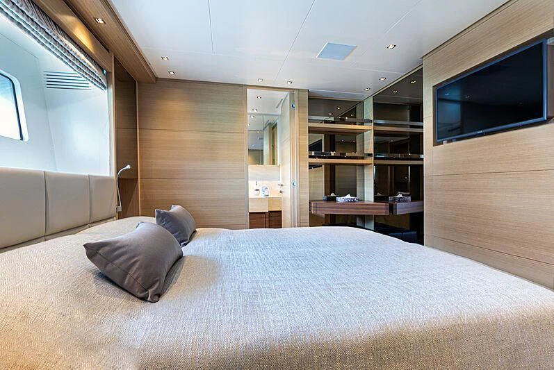 a bed in a room aboard THE UNIFIER KING ABDULAZIZ THE FIRST Yacht for Sale