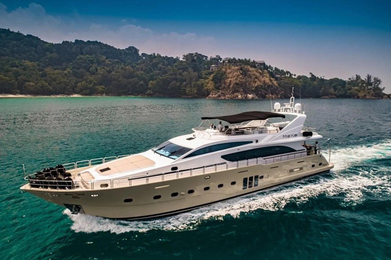 a white yacht on the water aboard MIA KAI Yacht for Charter