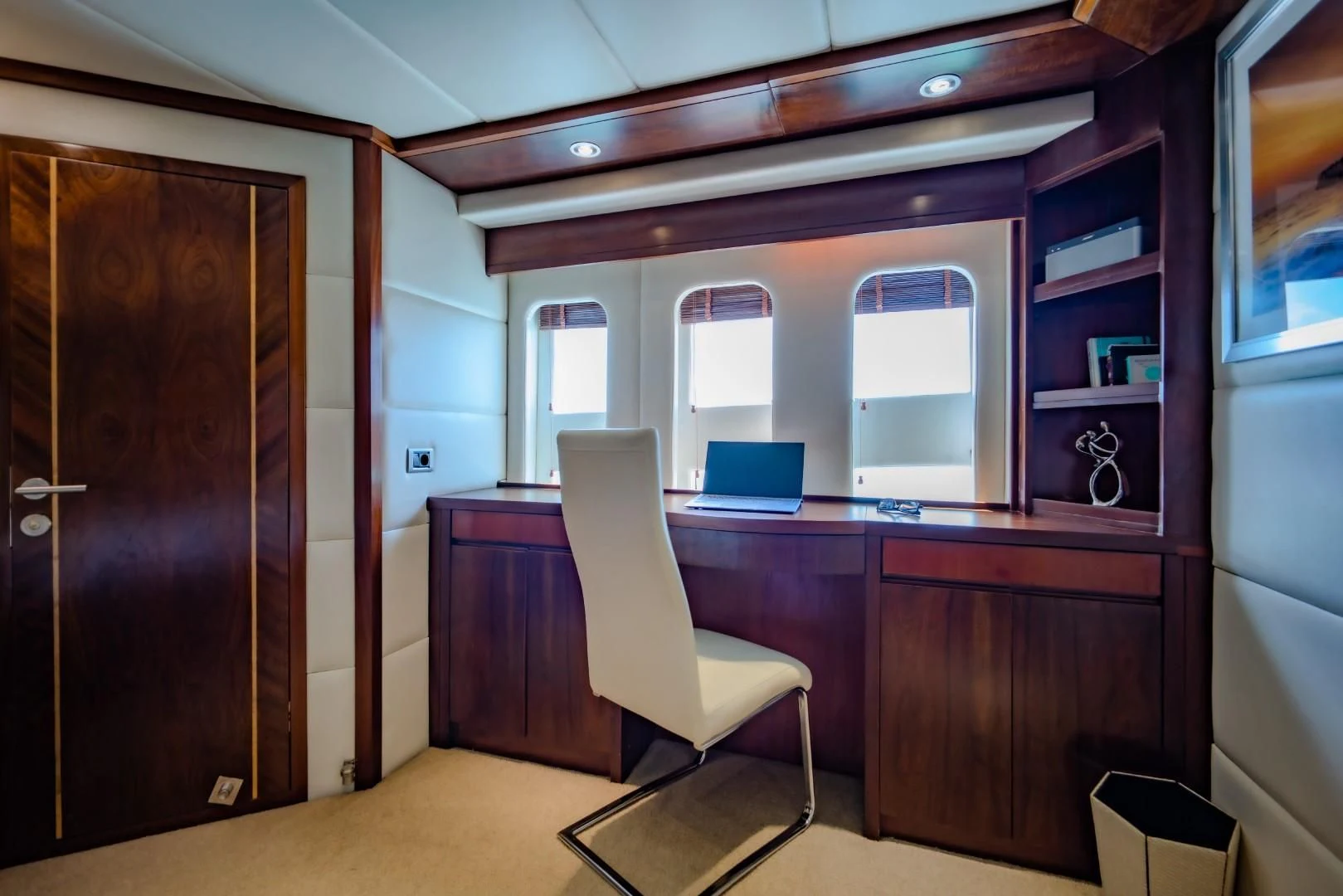 a room with a desk and a chair aboard MIA KAI Yacht for Charter