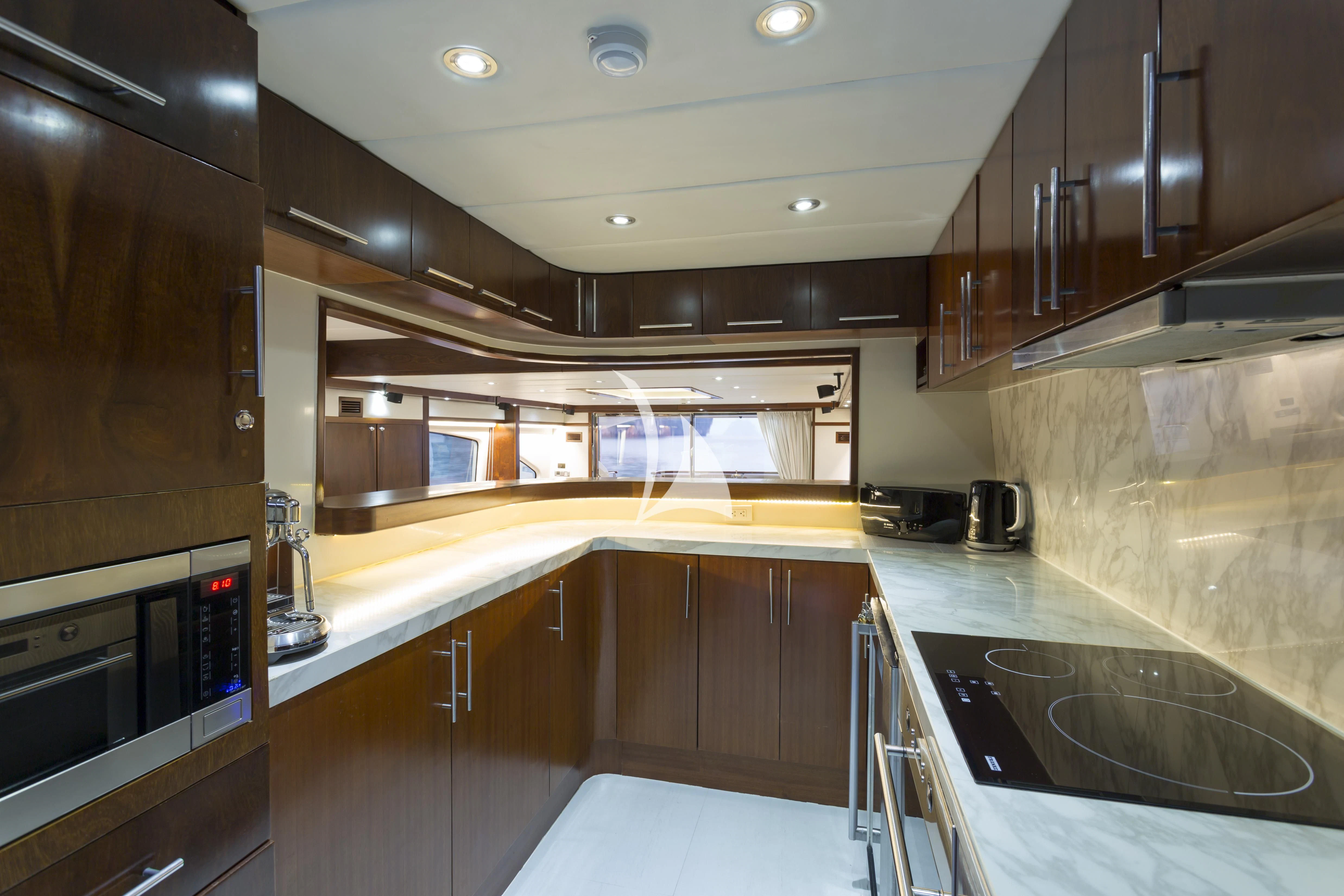a kitchen with a large island aboard MIA KAI Yacht for Charter