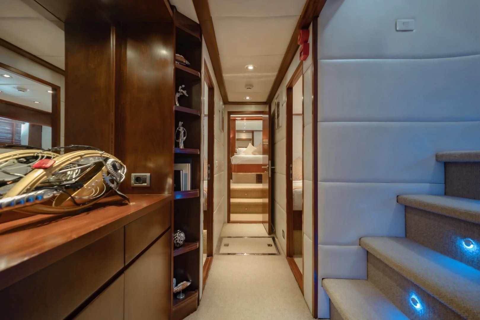 a room with a shelf and a bed aboard MIA KAI Yacht for Charter
