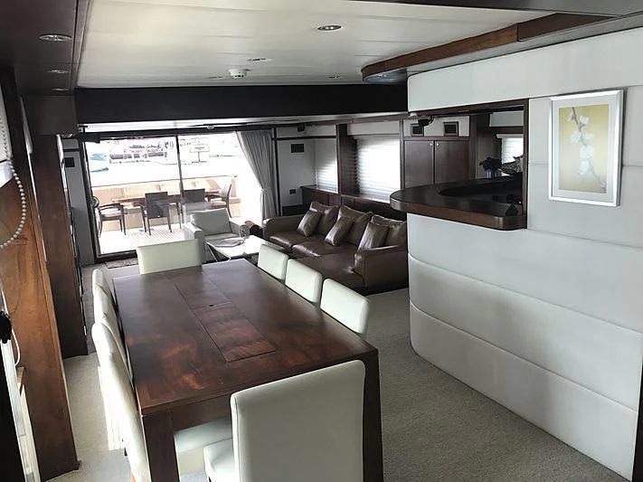 a living room with a table and chairs aboard MIA KAI Yacht for Charter