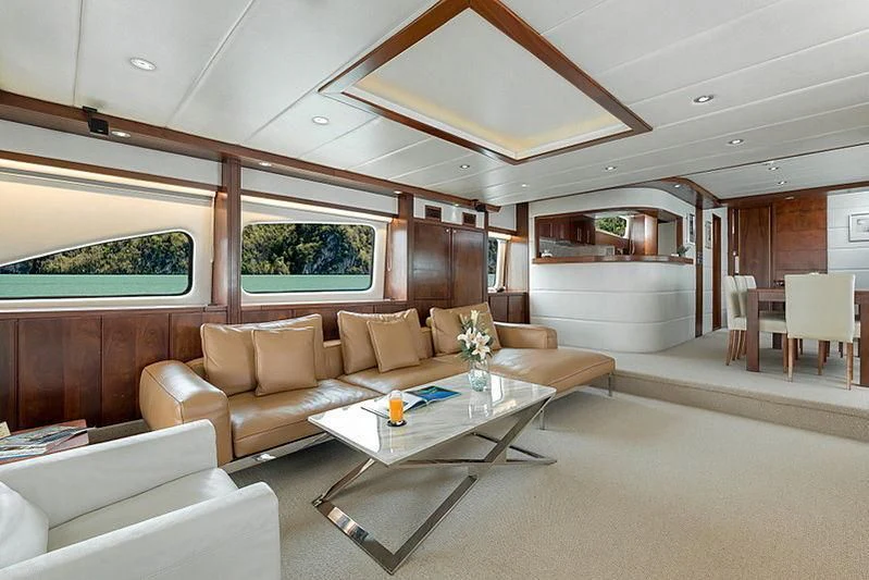 a living room with a couch and a table aboard MIA KAI Yacht for Charter