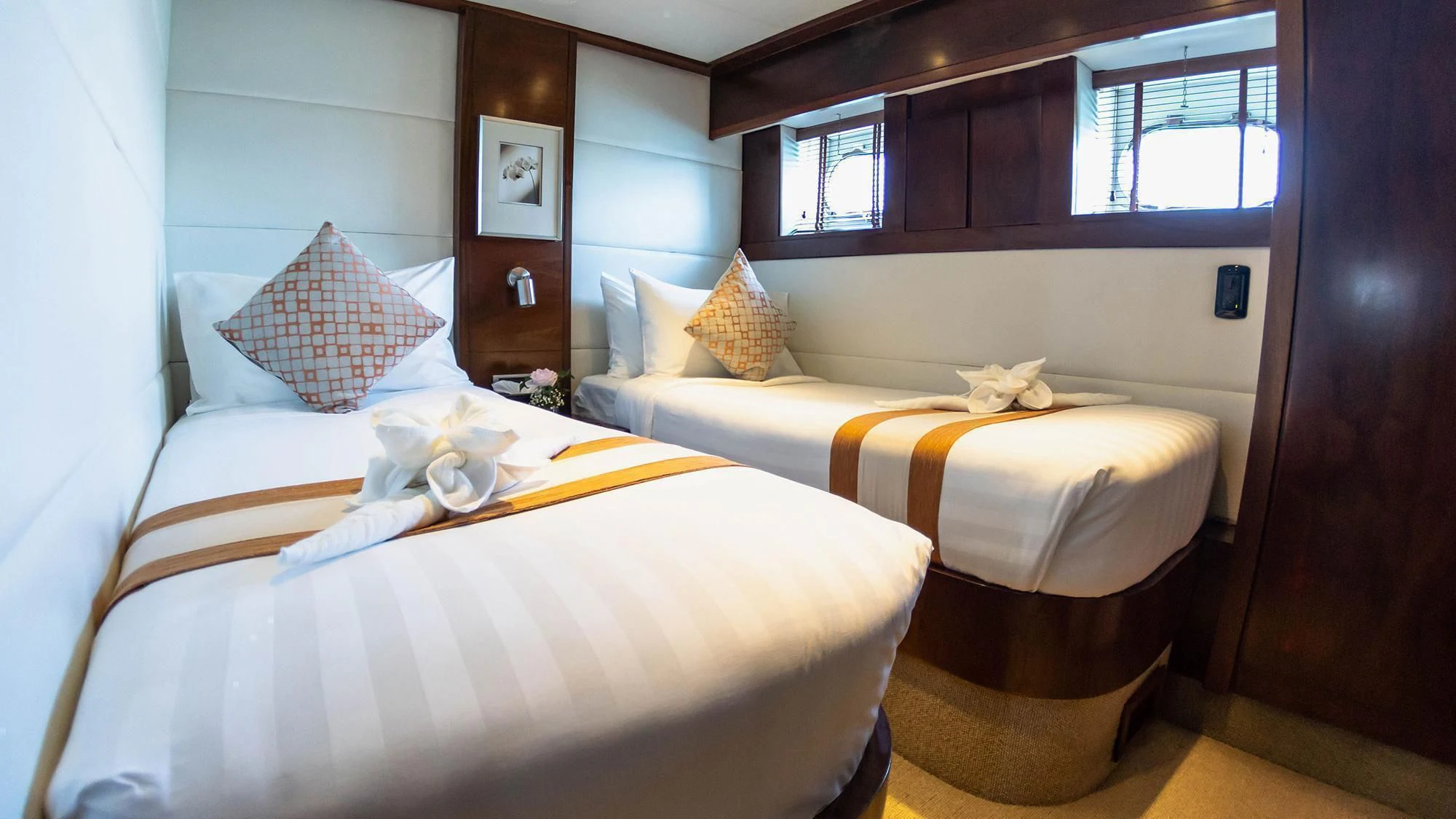 a room with two beds aboard MIA KAI Yacht for Charter