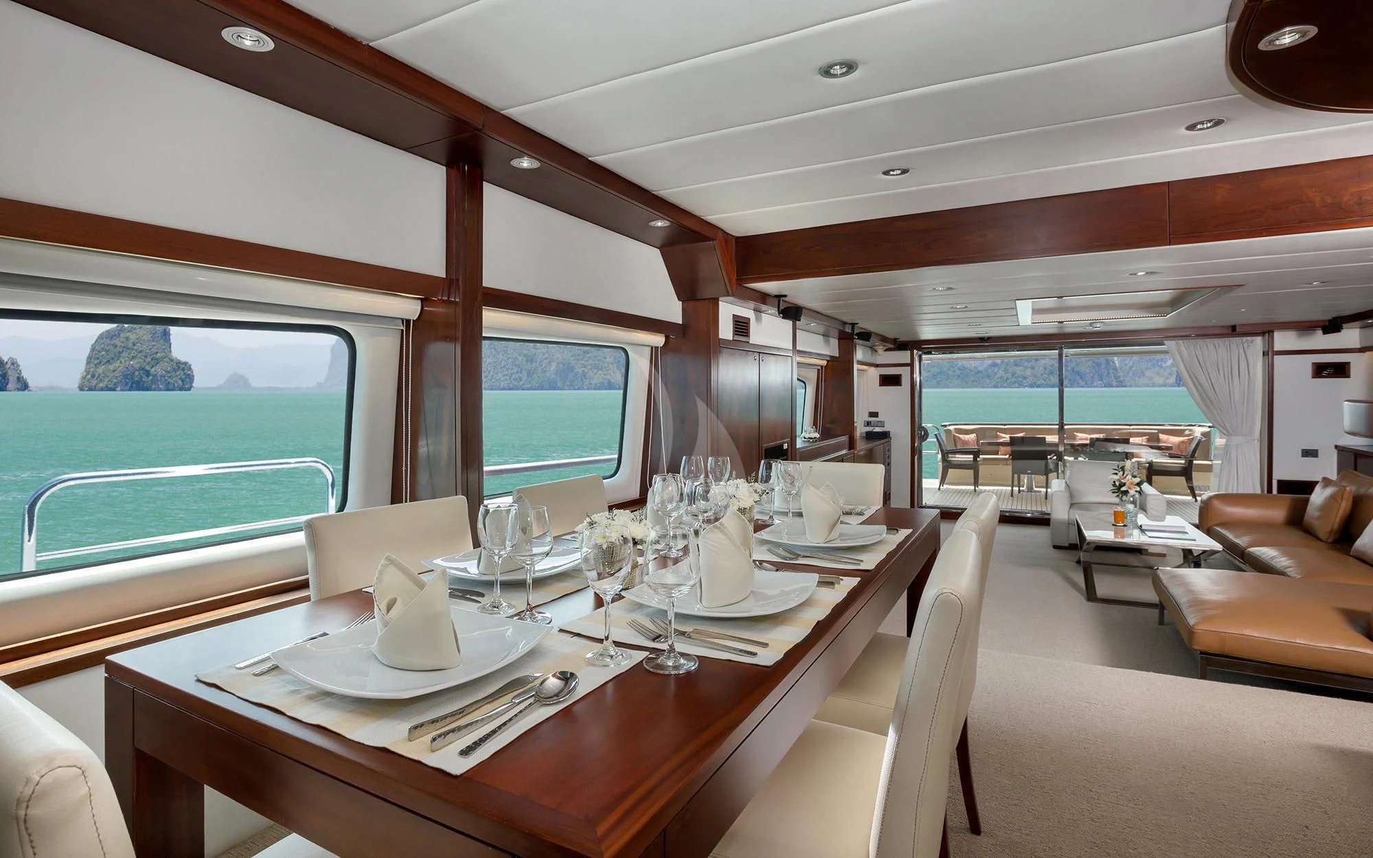 a table with wine glasses on it aboard MIA KAI Yacht for Charter