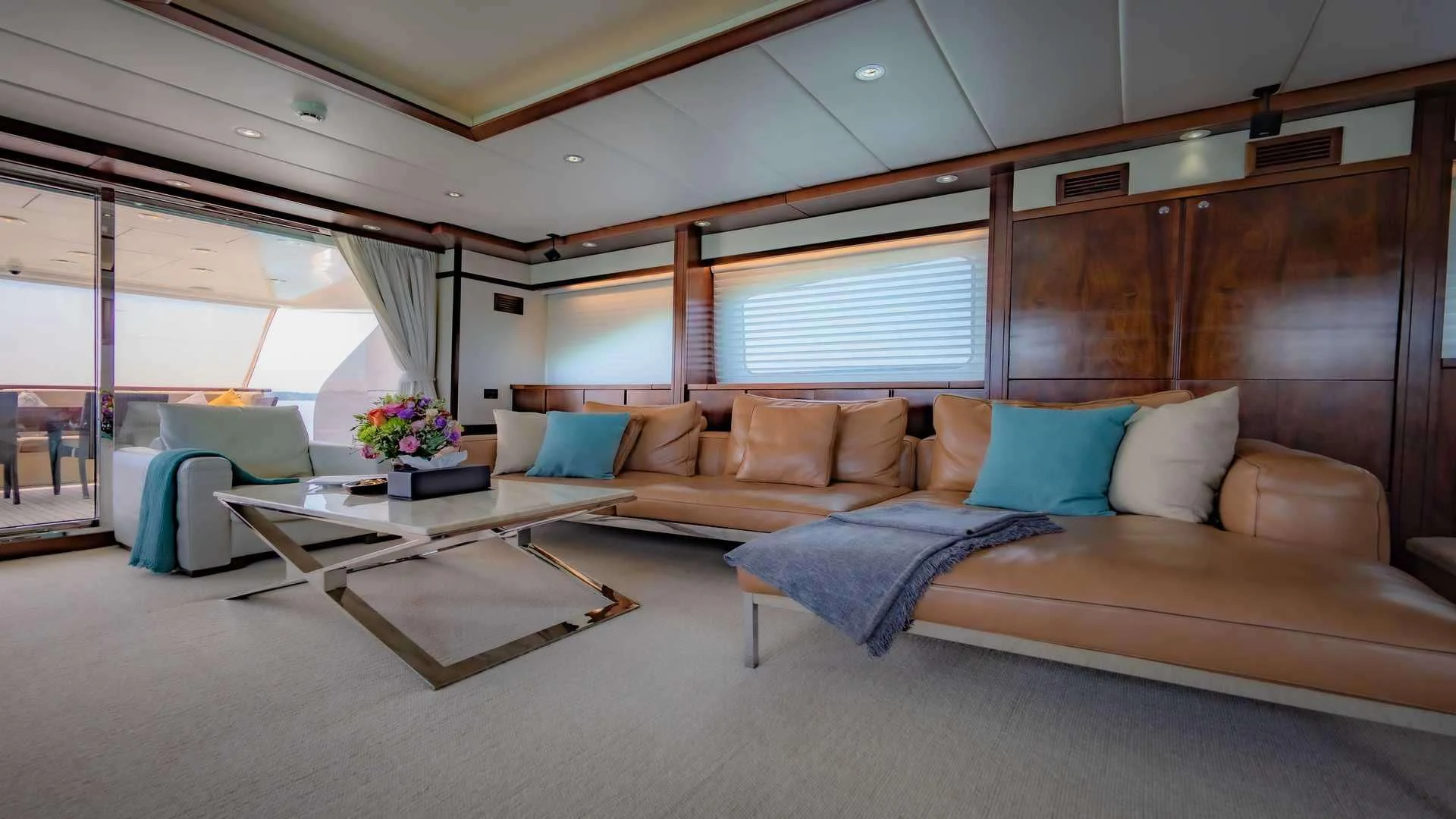 a large room with a couch and a table aboard MIA KAI Yacht for Charter