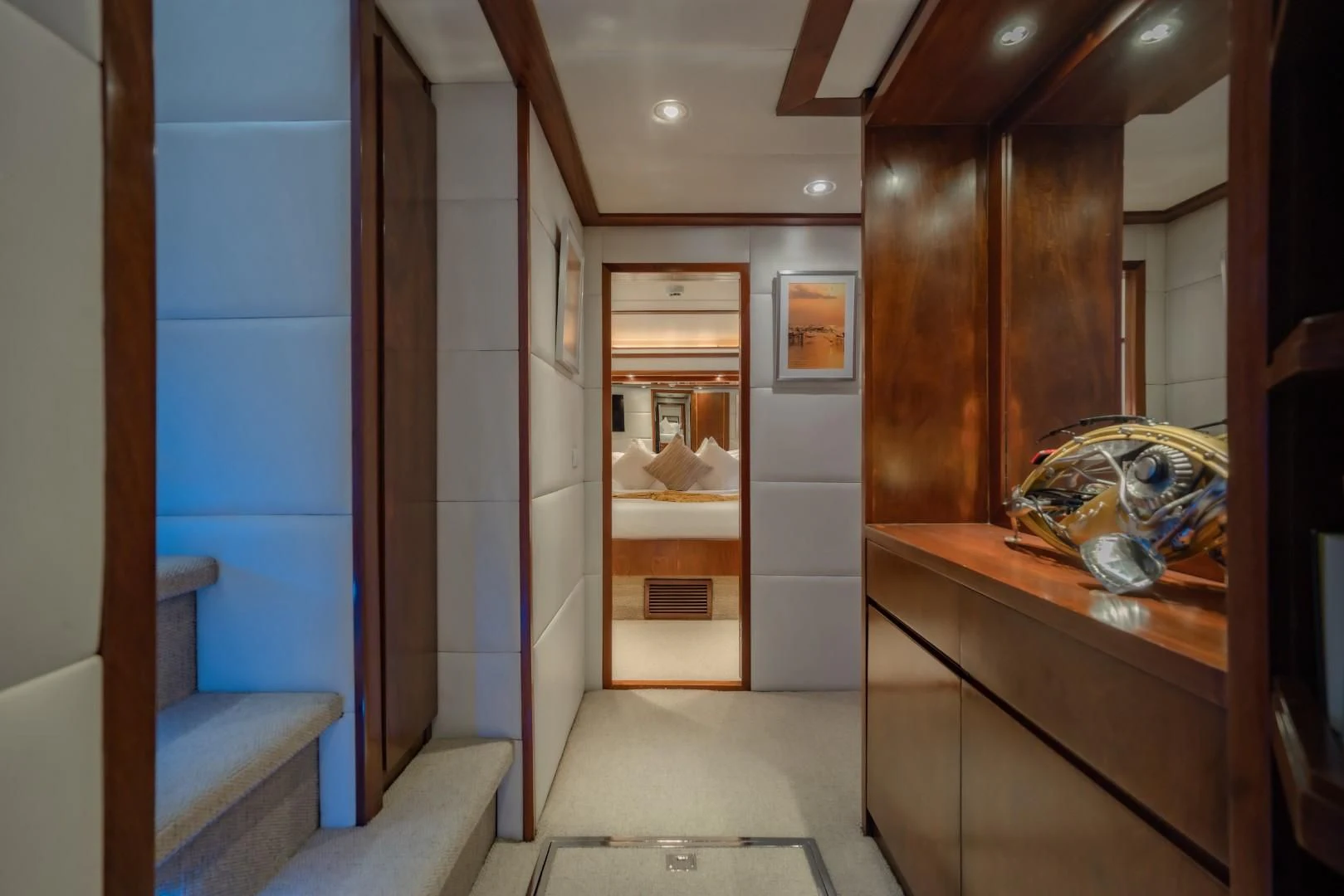 a room with a mirror and a bench aboard MIA KAI Yacht for Charter