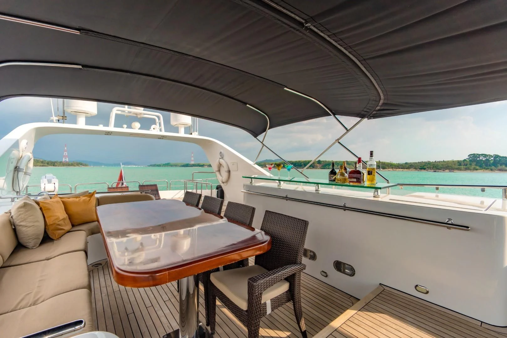 a boat with a table and chairs aboard MIA KAI Yacht for Charter