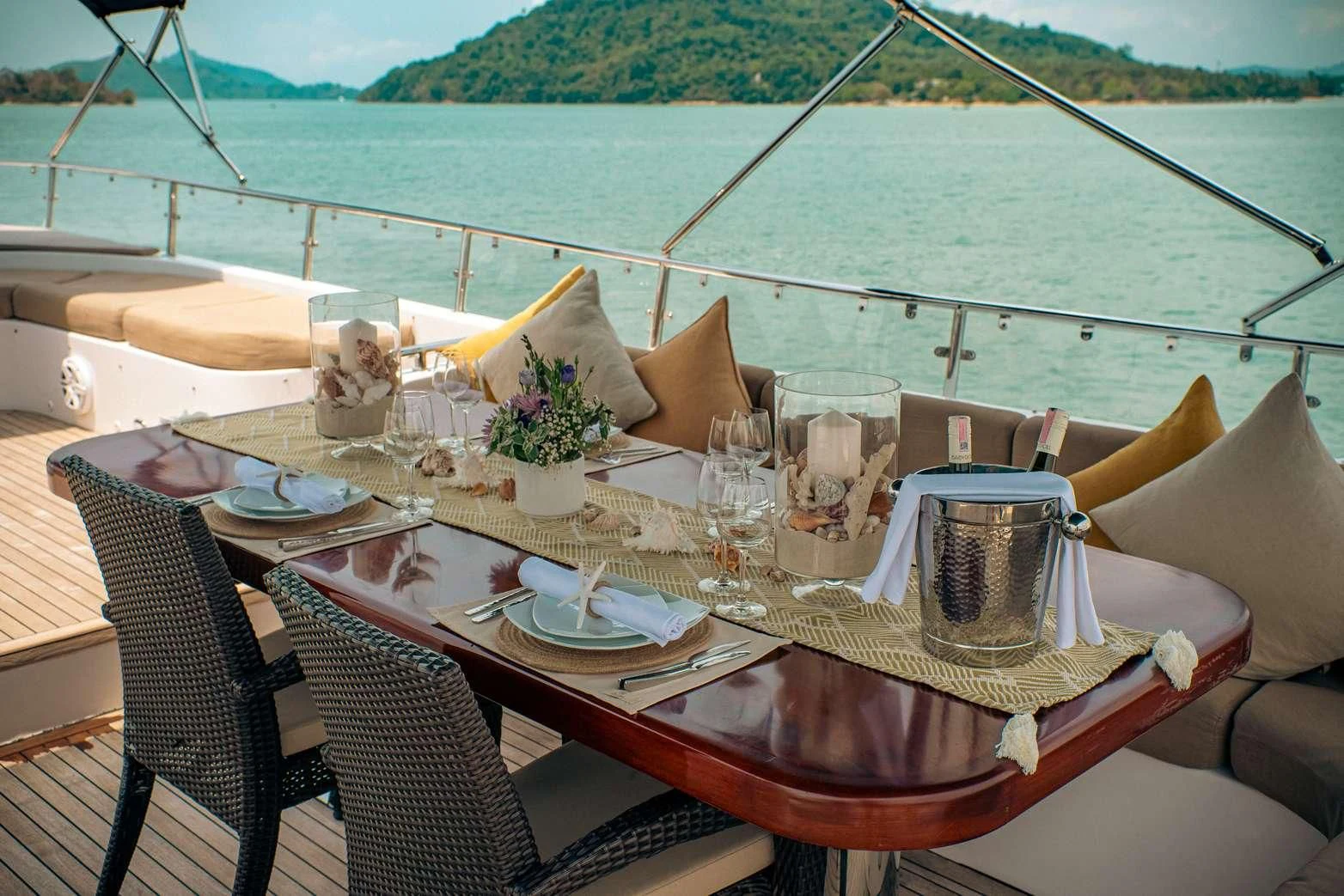 a table set with place settings aboard MIA KAI Yacht for Charter