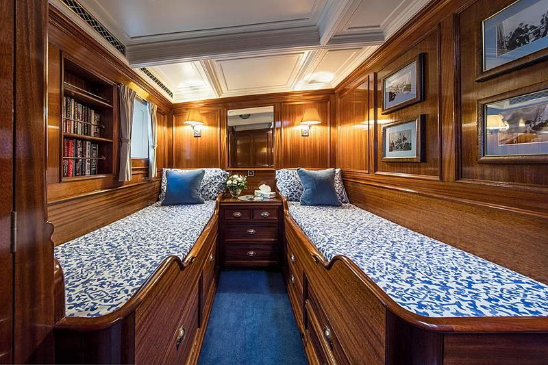a large bedroom with a large bed aboard ADELA Yacht for Sale