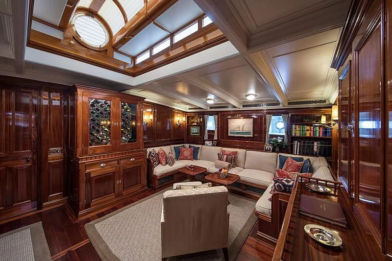 a living room with a wood paneled ceiling aboard ADELA Yacht for Sale