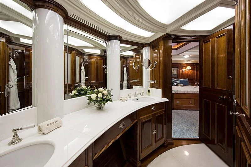 a bathroom with a large mirror aboard ADELA Yacht for Sale