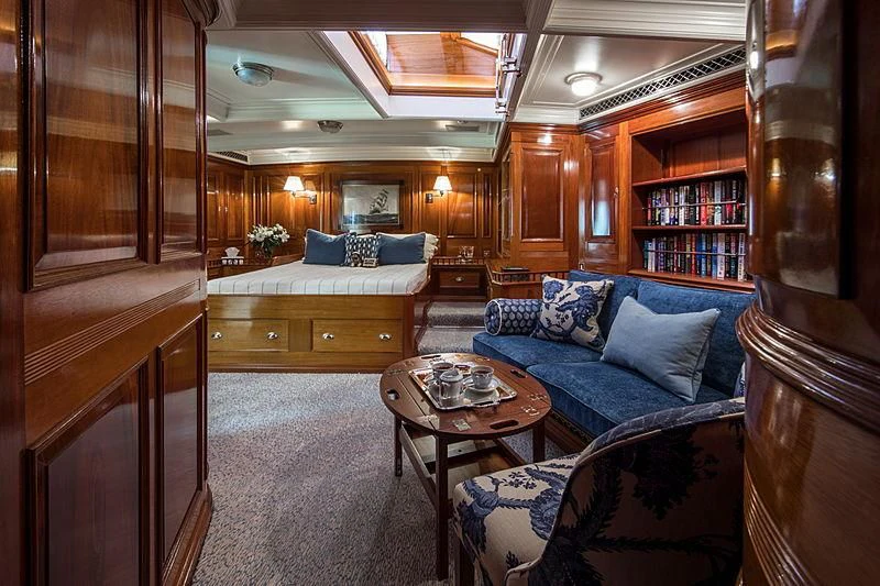 a living room with a couch and a coffee table aboard ADELA Yacht for Sale