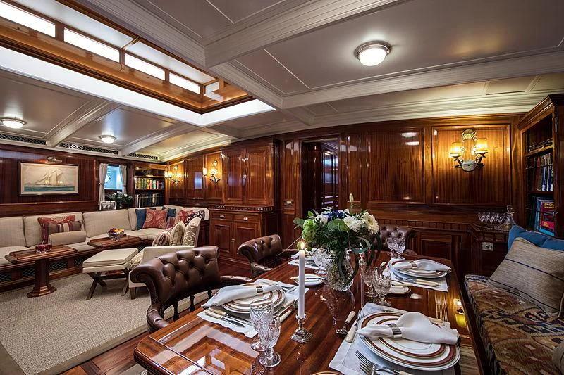 a living room with a large wood paneled ceiling aboard ADELA Yacht for Sale