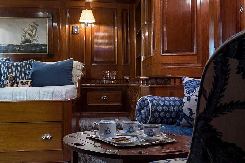 a room with a bed and a chair aboard ADELA Yacht for Sale