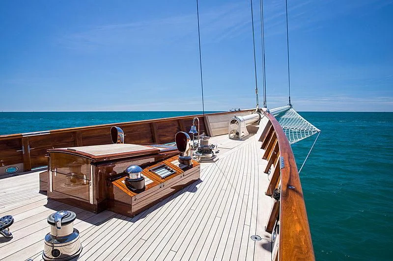 a wooden boat on a deck aboard ADELA Yacht for Sale