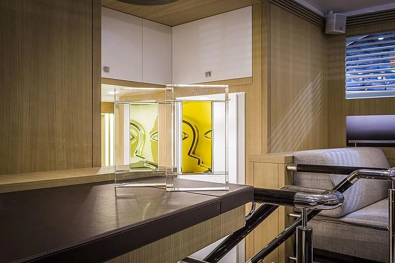 a room with a painting on the wall aboard O NOSO UNO Yacht for Sale