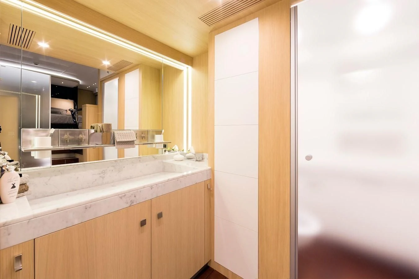 a bathroom with a large mirror aboard O NOSO UNO Yacht for Sale