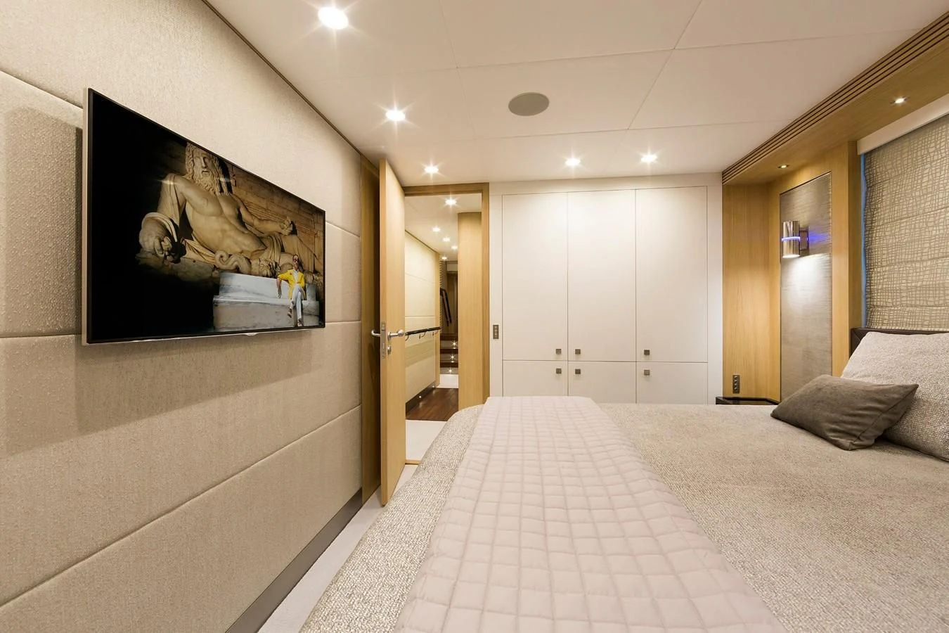 a large white room with a large mirror and a bed aboard O NOSO UNO Yacht for Sale