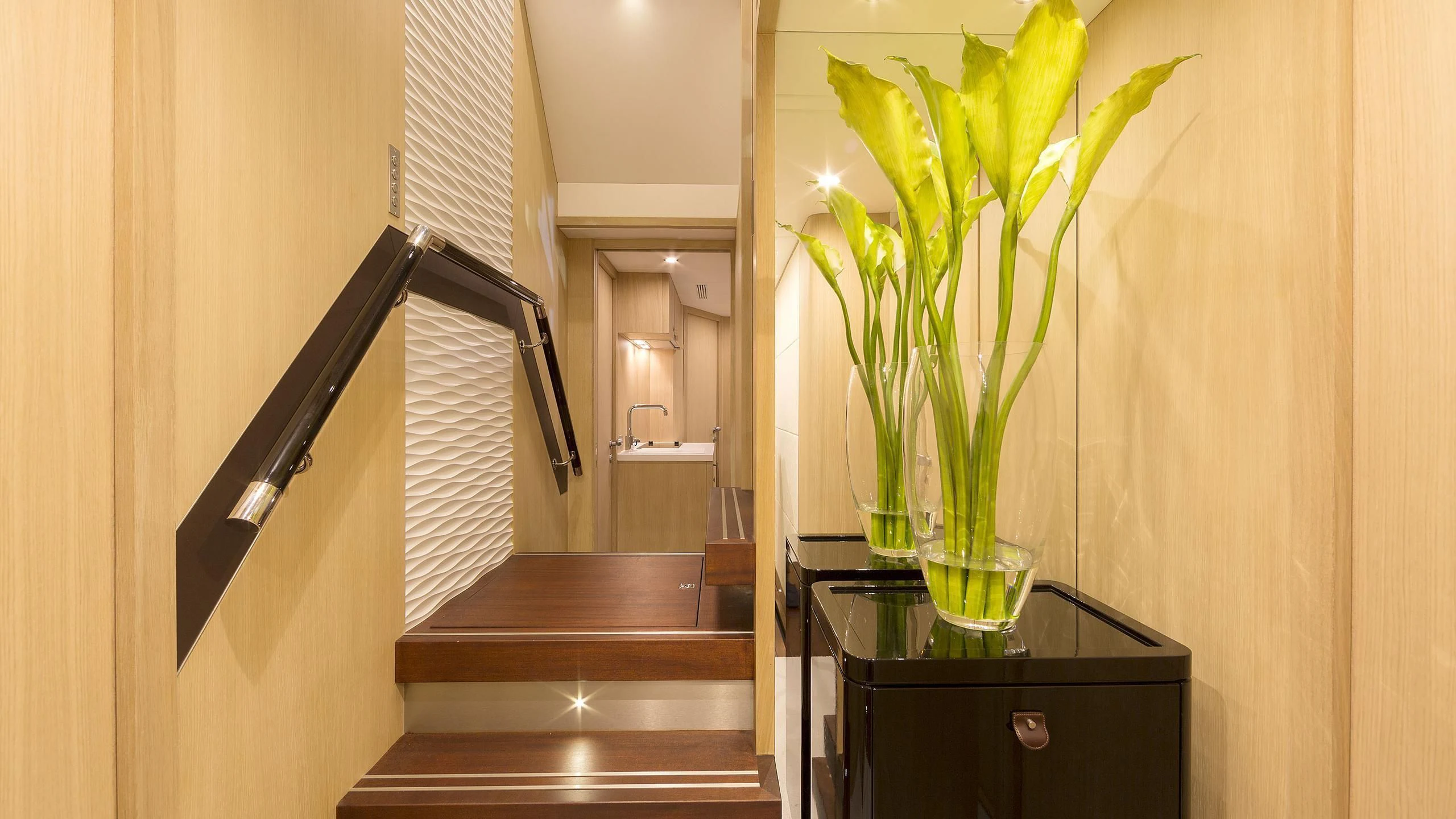 a vase with flowers on a table aboard O NOSO UNO Yacht for Sale