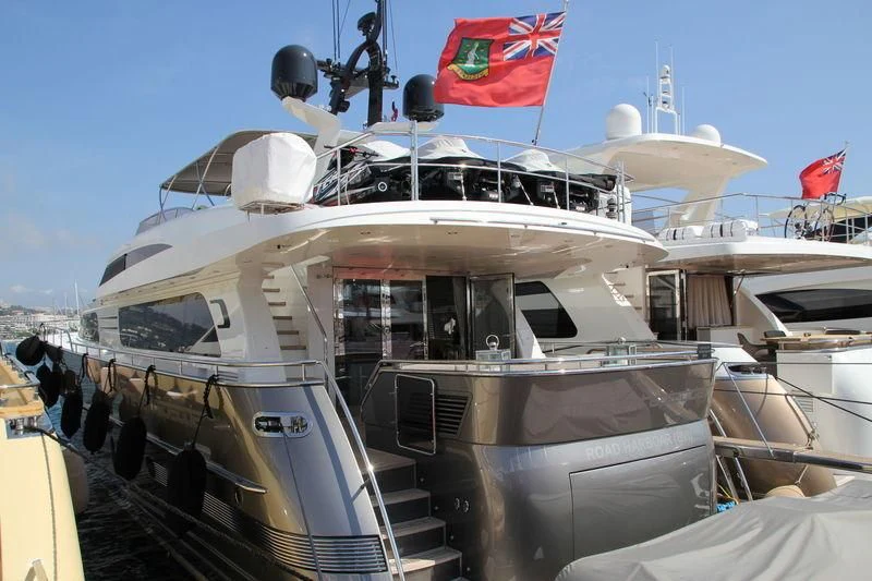 a large military boat with flags on the deck aboard O NOSO UNO Yacht for Sale