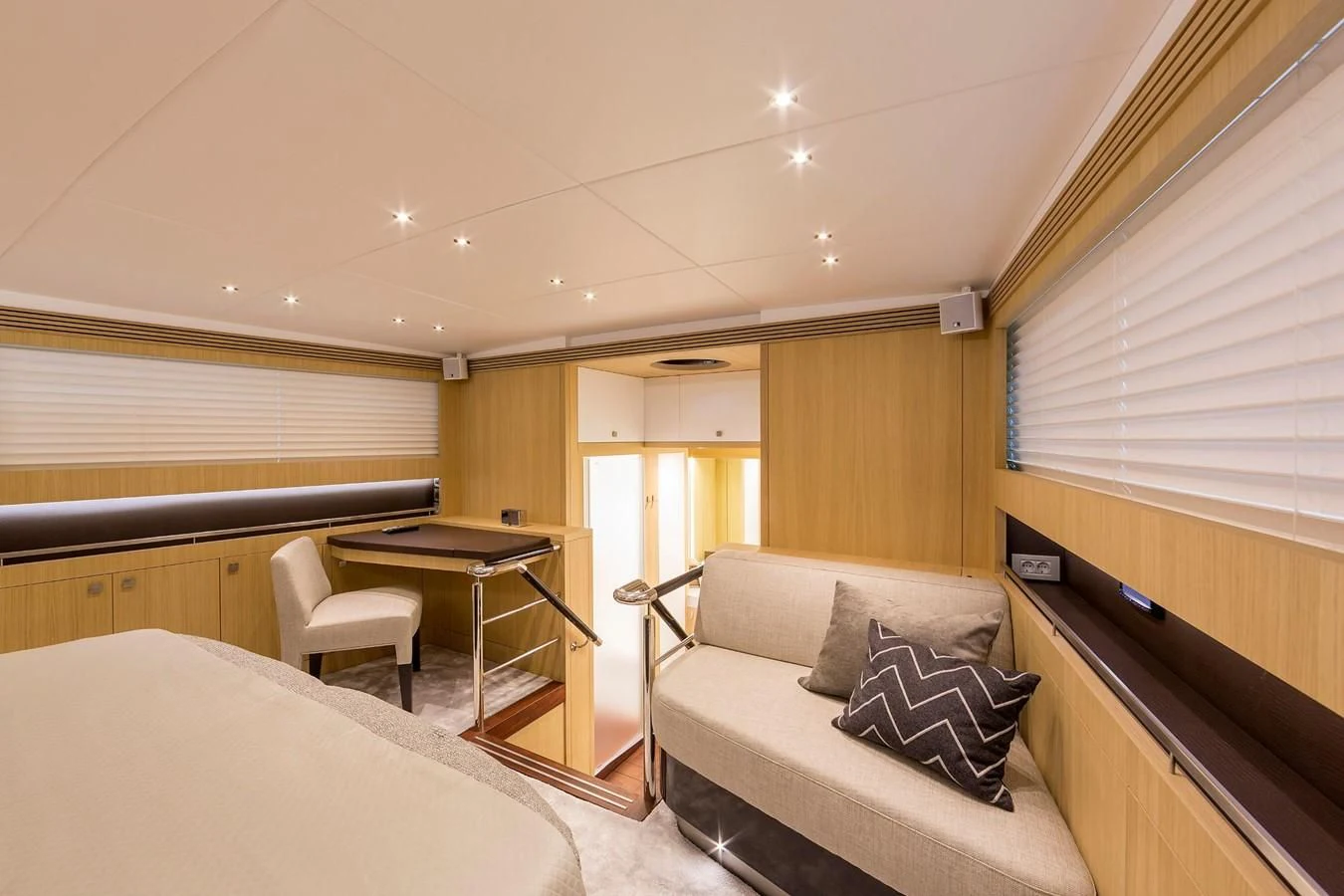 a room with a bed and a desk aboard O NOSO UNO Yacht for Sale
