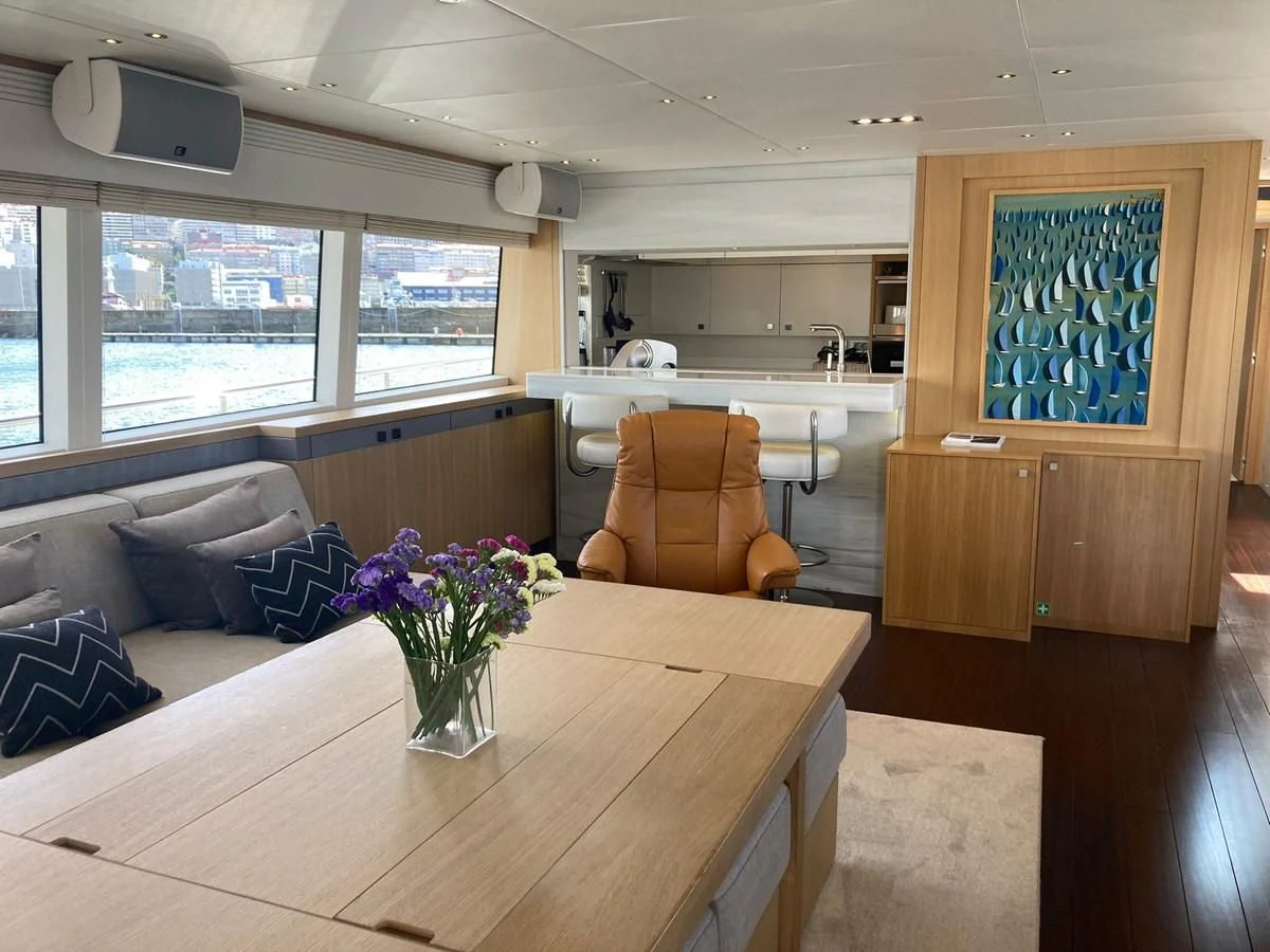 a vase of flowers on a table aboard O NOSO UNO Yacht for Sale