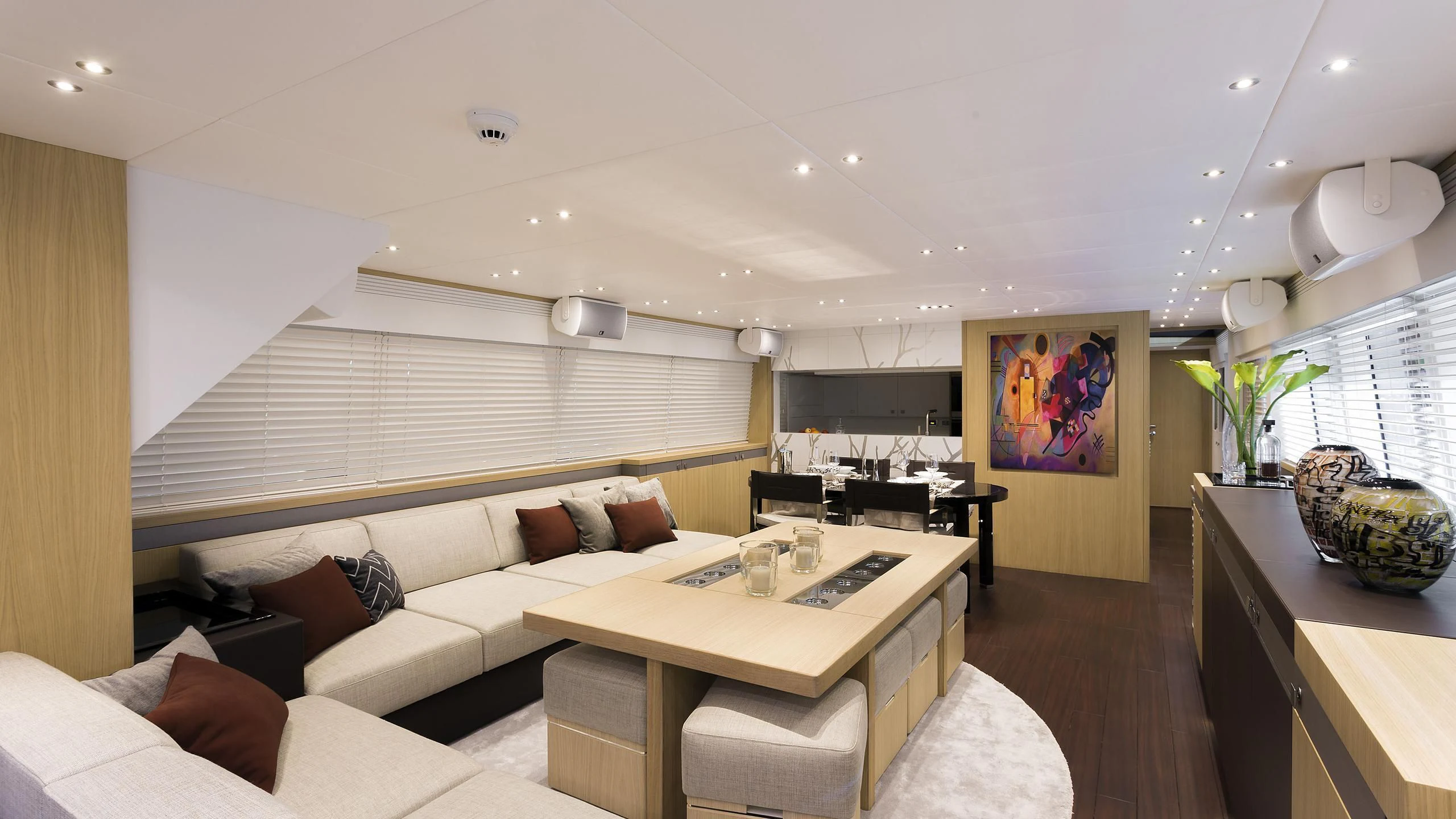 a living room with a couch and a table aboard O NOSO UNO Yacht for Sale