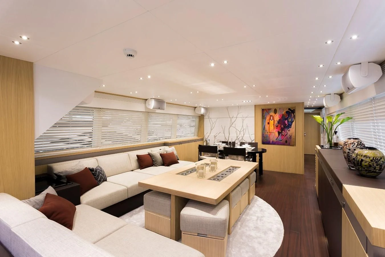a living room with a couch and a table aboard O NOSO UNO Yacht for Sale