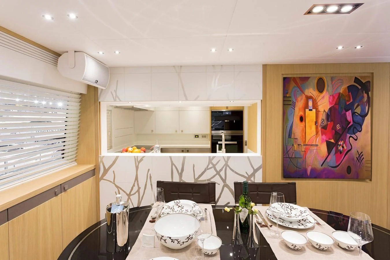 a dining room with a painting aboard O NOSO UNO Yacht for Sale