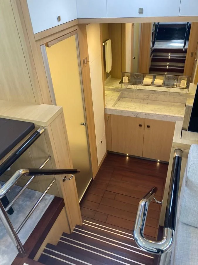 a kitchen with a wood floor aboard O NOSO UNO Yacht for Sale